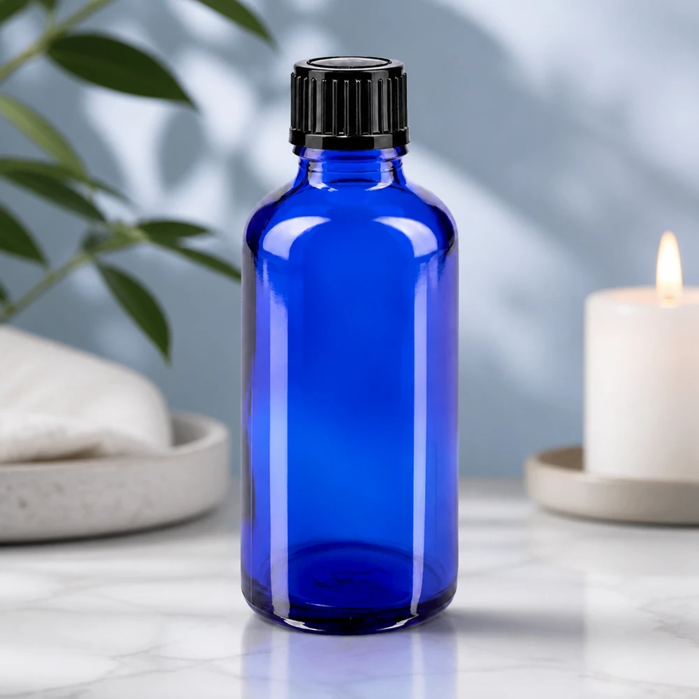 Apothekenflasche blau 50ml Tropfverschluss 1mm schwarz Standard Hochwertige 50ml Rundflasche aus blauem UV-Schutzglas mit schwarzem Dosierverschluss