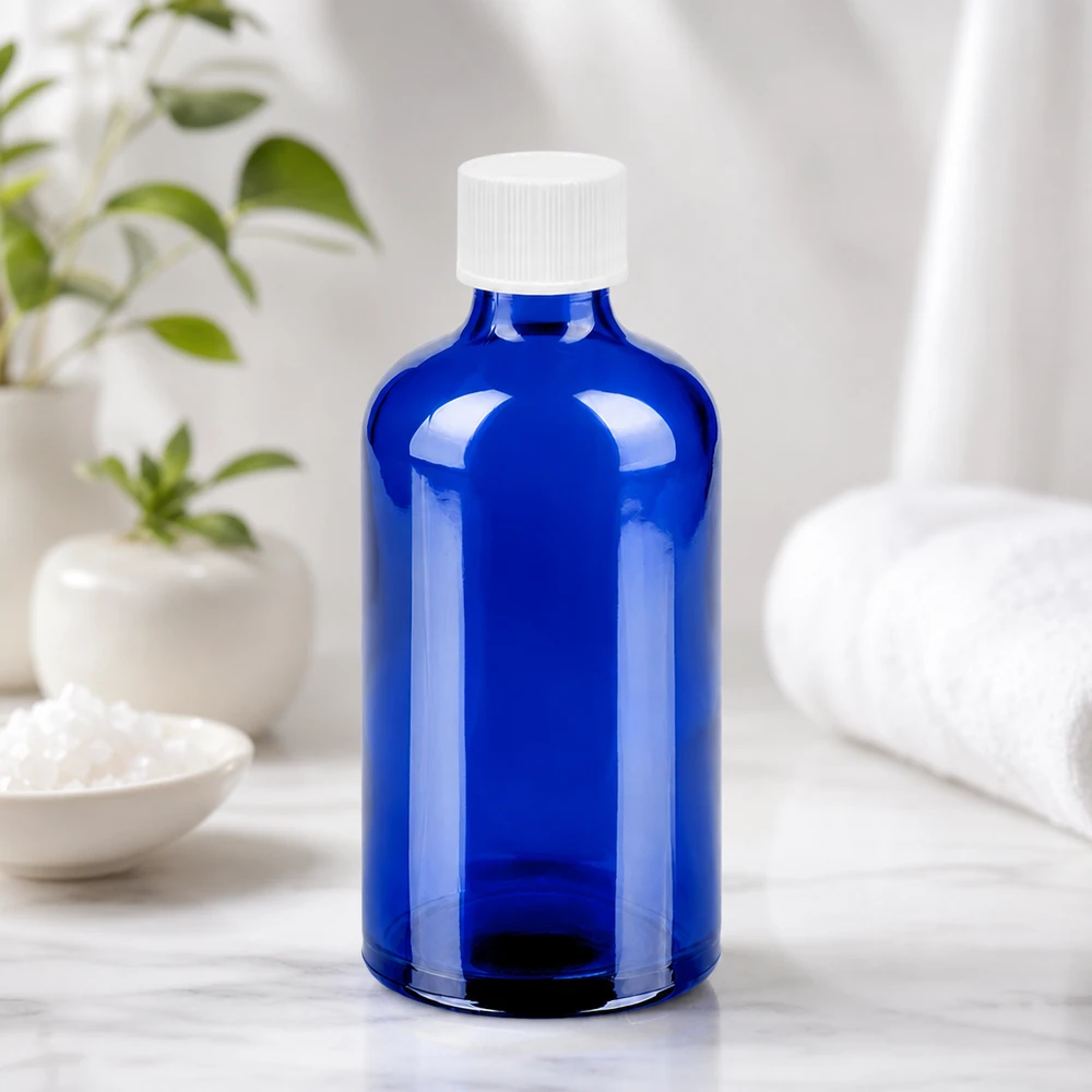 Vielseitige Kobaltblaue Glasflasche 100ml mit weißem 11mm Gewinde für unterschiedliche Füllgüter