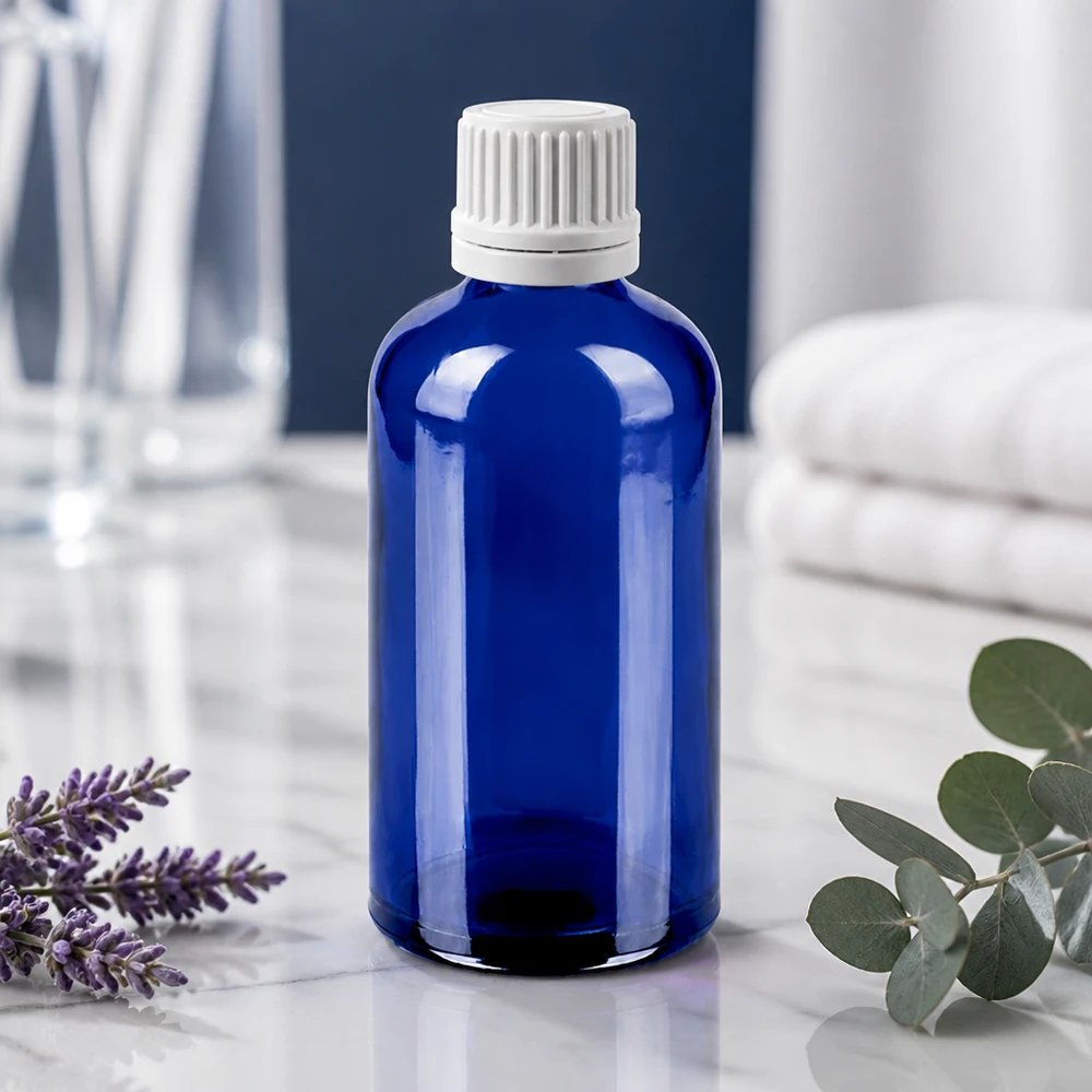 100ml Tropfflasche 0.7mm weiß Originalitätsverschluss BlueLine UT18/100 Nachhaltige Tropfflasche 100ml aus recycelbarem blauen Glas mit auslaufsicherem Verschluss