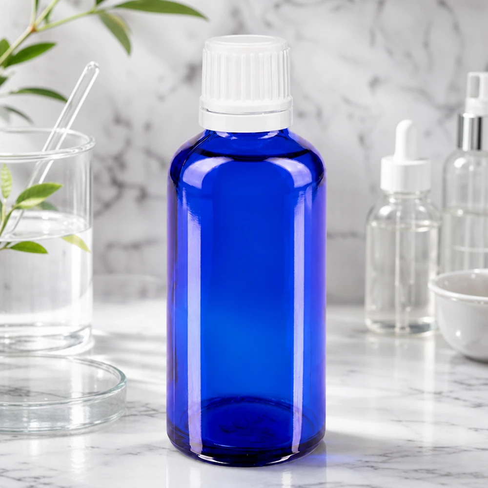 Apothekenflasche blau 50ml Tropfverschluss 1.2mm weiß Originalitätsverschluss Zylindrische blaue Glasflasche 50ml mit weißem Schraubverschluss und integriertem Tropfer 0,7mm