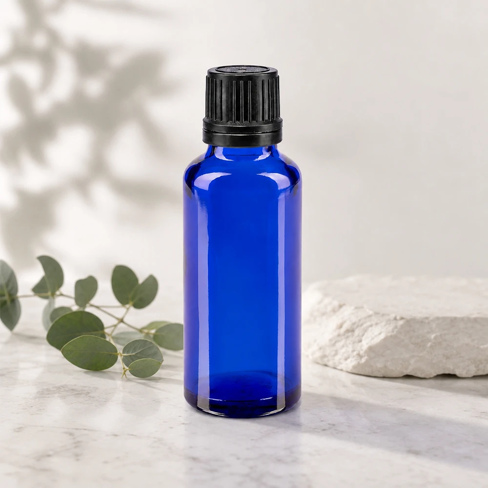 Apothekenflasche blau 30ml Tropfverschluss Giessring 1mm schwarz Originalitätsverschluss Medizinische Blauglasflasche 30ml mit schmalem Flaschenhals und schwarzem OV-Aufsatz
