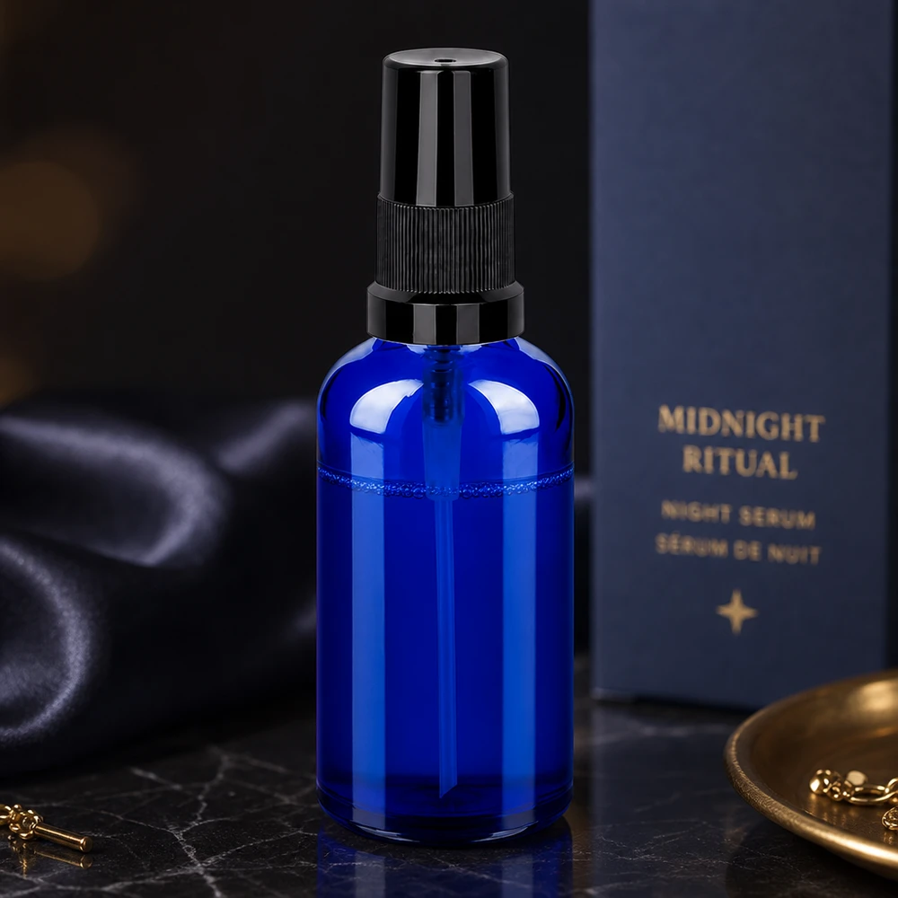 Elegante blaue 50ml Sprayflasche aus Glas mit schwarzem Sprühkopf für natürliche Pflegeprodukte