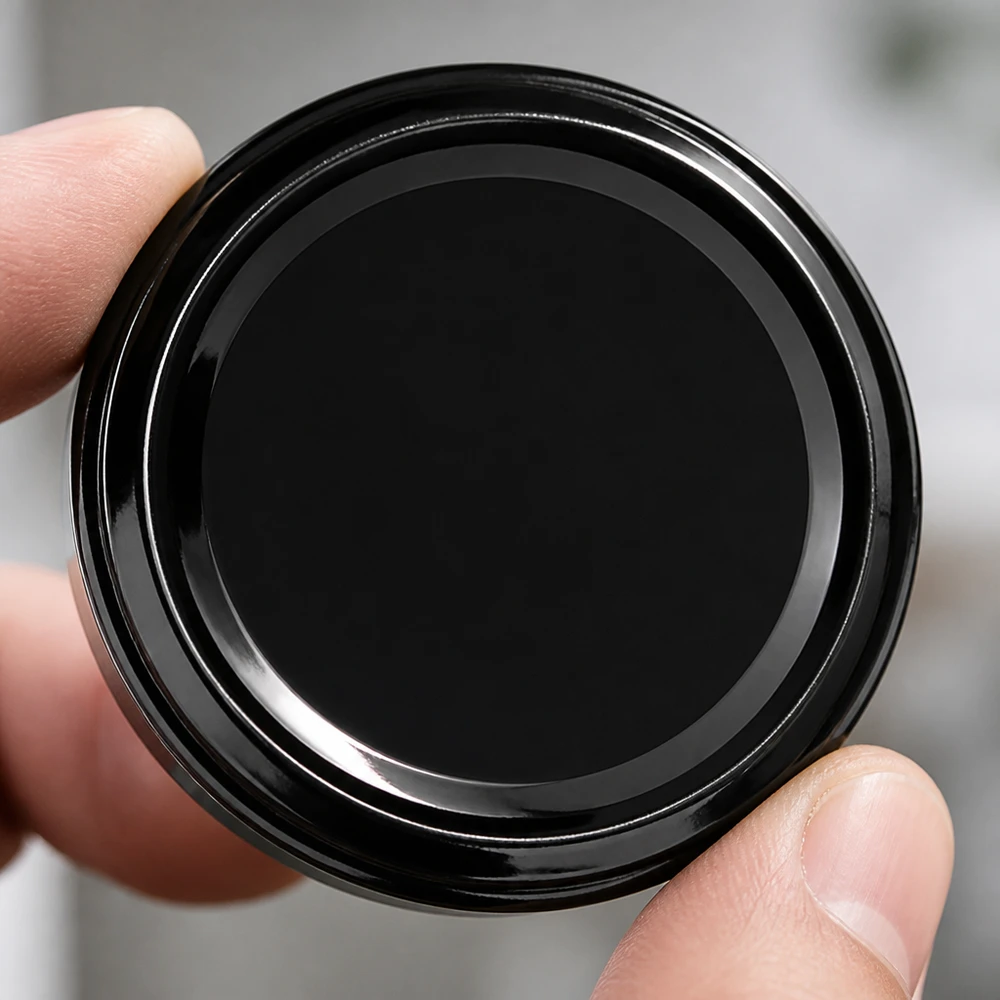 63mm BioSeal Deckel schwarz (TO63) UNiTWIST Makroaufnahme schwarzer UNiTWIST Schraubverschluss TO63 BioSeal unitemp glatte Deckelfläche