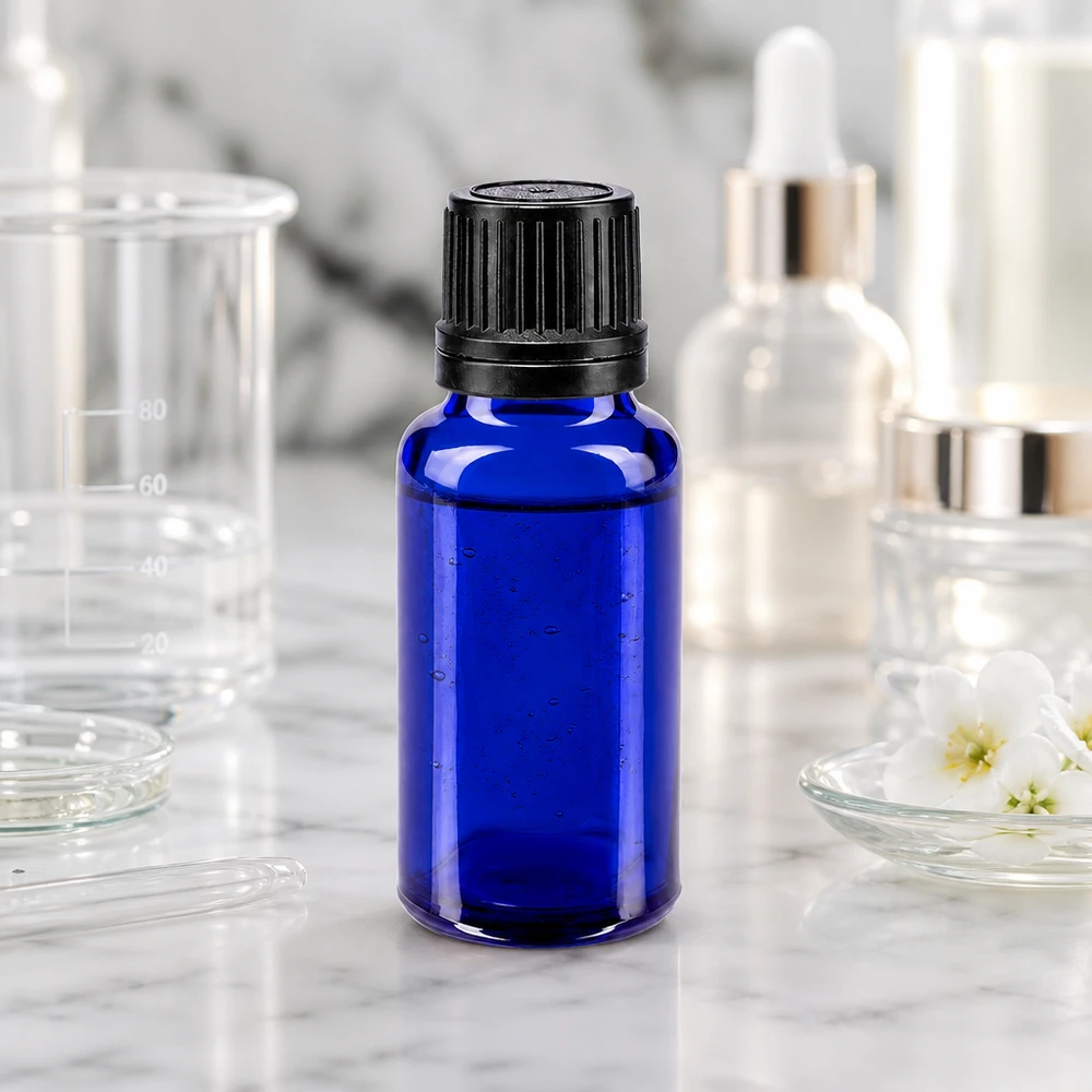 Apothekenflasche blau 20ml Schraubverschluss schwarz Giessring Originalitätsverschluss Dunkelblaue 20ml Flasche aus Apothekerglas mit 8mm Ausgießer zwischen Serumflaschen