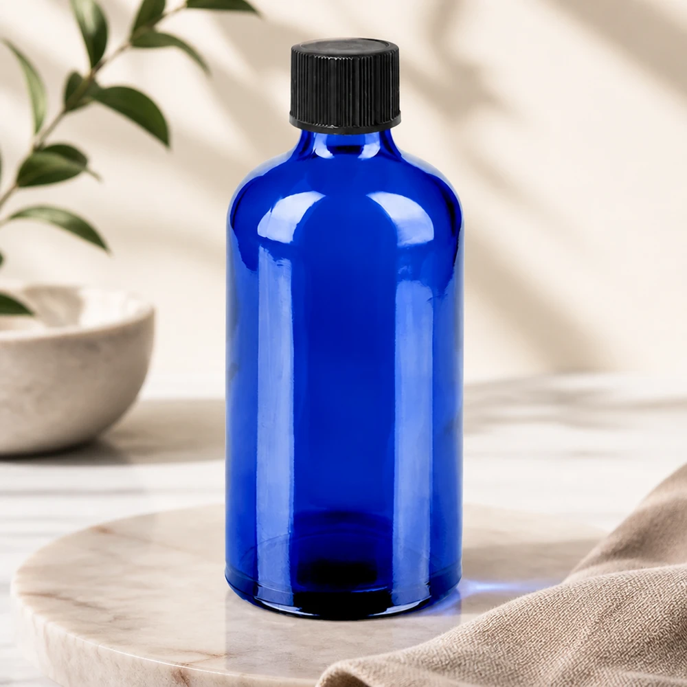 Stilvolle blaue Glasflasche 100ml mit tropfgenauer Abgabe für Naturkosmetik und Heilpflanzenextrakte