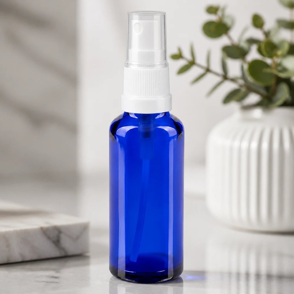 Wiederbefüllbare blaue Glas Sprühflasche 30ml für ätherische Öle und Seren