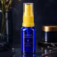 Dunkelblaue 30ml Glasflasche mit gelbem Feindosierer transparenter Kappe für Kosmetikserum