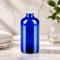 Professionelle Tropfflasche BlueLine UT18/100 aus blauem Glas mit weißem Standardgewinde