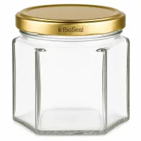 Sechseckiges Glasgefäß UNiTWIST Hexa47 mit goldenem TO43 BioSeal Deckel für Konservierung und Aufbewahrung