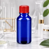 Präzisionsflasche 20ml aus UV-beständigem Cobaltglas mit hochwertigem roten Schraubdeckel