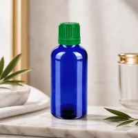 Stilvolle 50ml Kobaltglasflasche mit grünem Deckel für hochwertige Naturkosmetik und Öle