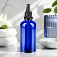 Premium Glasflasche 100ml kobaltblau mit schwarzer Pipette für hygienische und sichere Lagerung