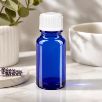 Runde blaue 10ml Glasflasche mit weißem Tropferverschluss für ätherische Öle