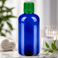 Stilvolle blaue Glasflasche 100ml mit mattgrünem Deckel perfekt für Küchenessenzen und Extrakte