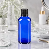 Zylindrische 50ml Apothekerflasche aus kobaltblauem Glas mit OV-Verschluss in 8mm Öffnung