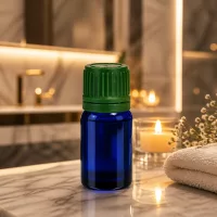 Dekorative blaue 5ml Glasflasche mit grünem Deckel als stilvolle Verpackungslösung