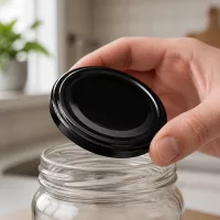 Schwarzer UNiTWIST BioSeal Deckel TO63 BPA-NI auf Rundglas mit Schraubgewinde unitemp